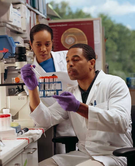 Two forensic scientists in a lab