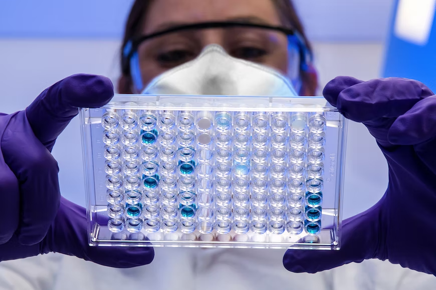 A doctor looking at DNA structures for cancer clues